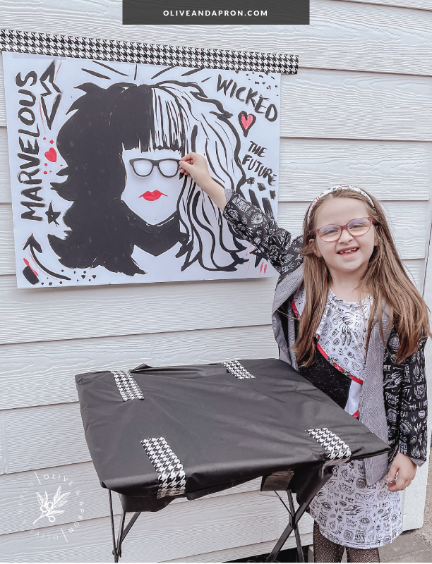 DIY party game of pin the glasses on Cruella.