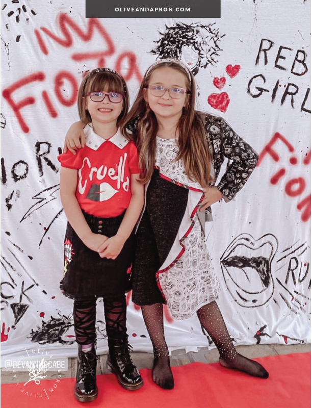 DIY custom Cruella themed photobooth backdrop using a queen sized bed sheet and spray paint!
